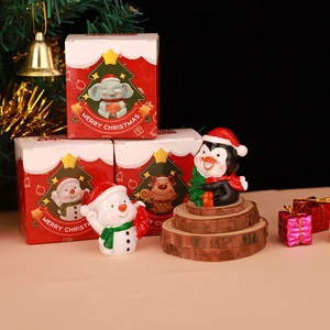 Miniature Christmas resin figurines set with snowman and penguin in decorative red gift boxes