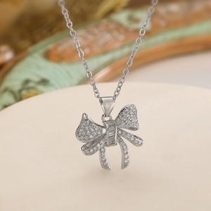 Silver bow necklace with sparkling zircon pendant on a delicate O-chain for women