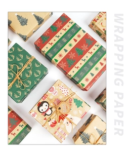Detail of eco-friendly brown kraft wrapping paper with reindeer and snowflake patterns