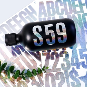 Silver laser glitter letter stickers applied on a black matte water bottle surface