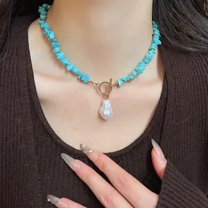 Bohemian turquoise beaded necklace with baroque pearl and golden toggle clasp detail
