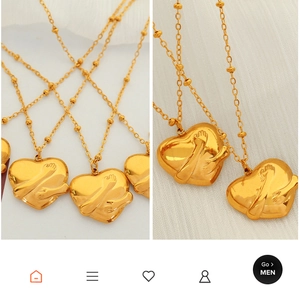 Detail of 18K gold-plated 3D heart-shaped pendant with hugging arms on a fine bead chain