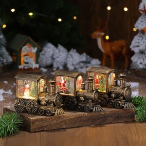 Vintage bronze Christmas train snow globe with LED lights and Santa Claus decoration