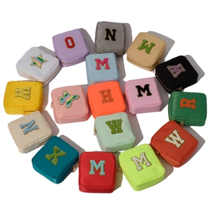 Colorful nylon zipper makeup bags with embroidered letters in a spiral layout
