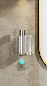 Close-up of wall-mounted clear acrylic bathroom storage box on marble wall surface