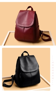 Detail view of stylish red and black leather backpacks with anti-theft zipper and logo
