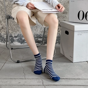 Women's cotton ankle socks with navy blue and white stripes in a modern minimalist style