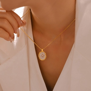 French retro gold plated oval mother of pearl necklace with square zircon on model