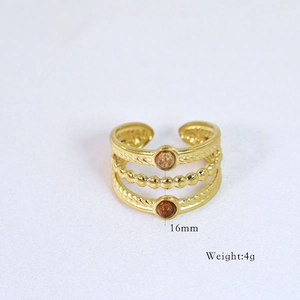 Detail shot of multi-layer 14k gold-plated ring with brown gems weighing 4g