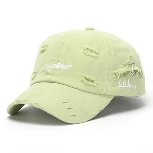 Detail of distressed light green baseball cap with Asher embroidery and metal rings