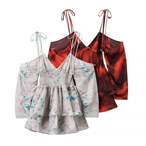 Detail of off-shoulder floral chiffon dresses with spaghetti straps and ruffled hemlines