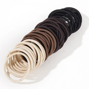 Elastic hair ties set in beige brown and black colors on a clean white background