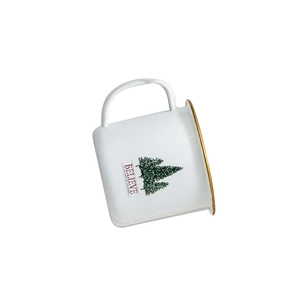 White enamel style Christmas mug with golden rim and evergreen tree illustration