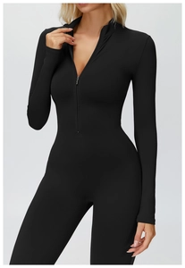 Close-up of black long sleeve thermal yoga jumpsuit with stand collar and front zipper