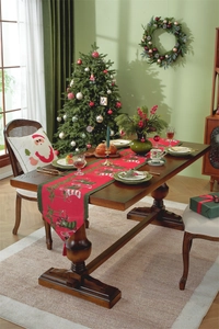 Festive red Christmas table runner with snowman patterns and matching holiday decor accessories