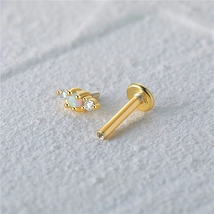 Macro view of S925 sterling silver flat back ear stud with opal and zircon inlay