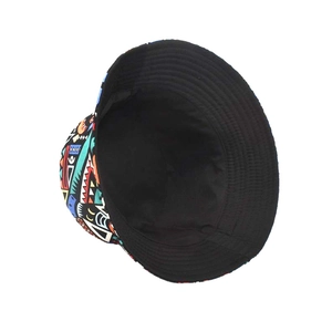 Detail of reversible bucket hat showing colorful geometric print and black interior lining