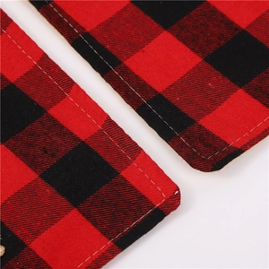 Close-up of red and black buffalo plaid placemat with durable double-stitched sewing details