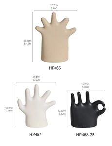 Detailed size chart for minimalist palm ceramic jewelry stands in matte black and white