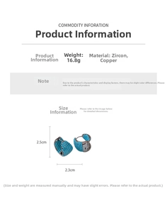 Detail view of gunmetal hoop earrings with turquoise zircon inlay on a white background