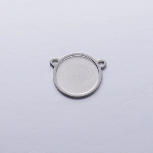 Detailed view of silver round 15mm stainless steel pendant tray with dual connector holes