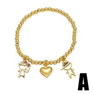Gold beaded stretch bracelet with charming boy, heart, and girl charms for women