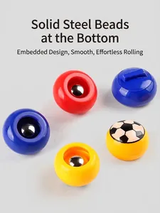 Close-up of smooth solid steel balls embedded in colorful tabletop game pucks