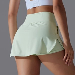 Rear view of mint green high-waisted tennis skort showing fit and dual-layer design
