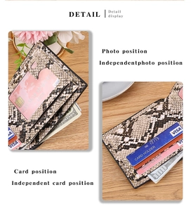 Detail view of snakeskin pattern leather wallet showing card slots and ID photo window