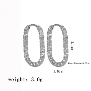 Polished silver oval hoop earrings with diamond-cut texture and 2.1cm height