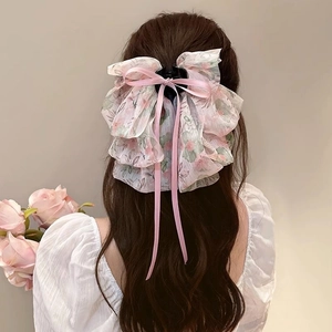 Detailed back view of pink floral organza bow hair claw clip with long ribbon streamers