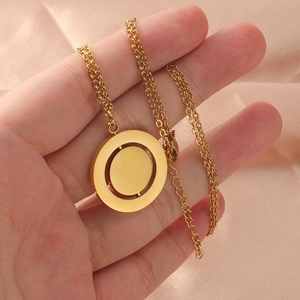 Golden stainless steel necklace featuring a rotatable double layered geometric pendant