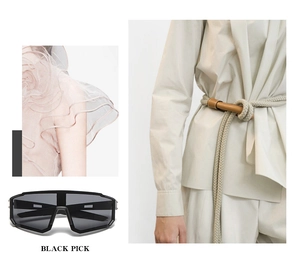 Detail view of stylish black oversized sports sunglasses with elegant model street style shots