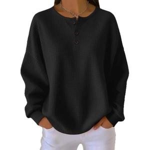 Fashionable black waffle knit long sleeve henley shirt with crew neck and buttons