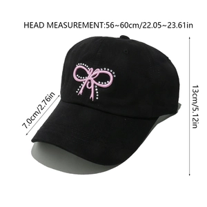 Detailed view of black baseball cap with bow embroidery and size dimensions chart