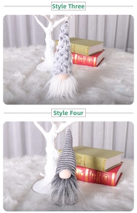 Detail of Christmas gnomes with grey spotted and striped knit hats and long faux fur beards