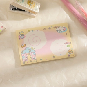 Detail of cute yellow and pink gradient memo pad with candy house and cloud illustrations