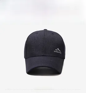 Detailed embroidery of mountain peak logo and branding on a dark twill baseball cap