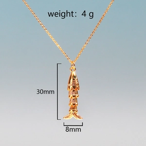 Detail view of gold koi fish pendant with 30mm height and 4g weight measurements