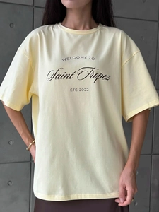 Detail of light yellow cotton T-shirt featuring Saint Tropez 2022 graphic print