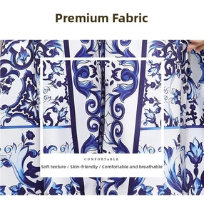 Detailed view of the blue floral porcelain pattern fabric with lotus and scroll motifs