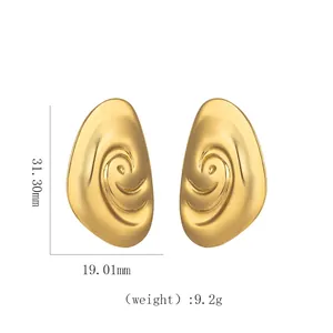 Macro detail of 18k gold geometric spiral earrings with size and weight measurements