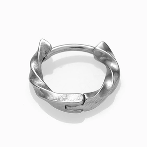 Detailed macro view of the twisted texture and secure clasp on vintage silver hoop earrings