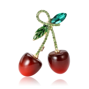 Exquisite cherry brooch with red resin fruit and green rhinestone leaves on golden branch