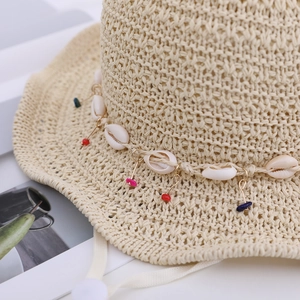 Ethnic straw hat with shell accents and colorful beads for children's sun protection
