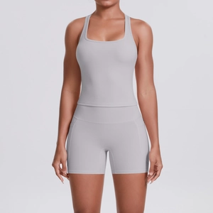 Detail view of high-elasticity grey yoga set with racerback top and side pocket shorts