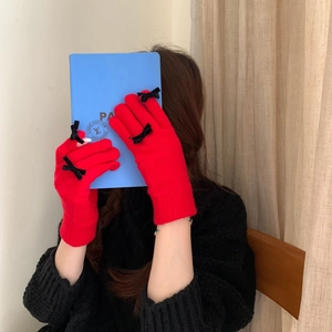 Chic red knitted gloves with black bows and touch screen function for winter warmth