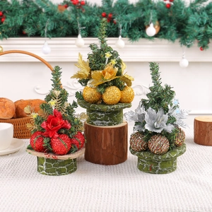 Set of three mini artificial Christmas trees with red, gold and silver festive ornaments