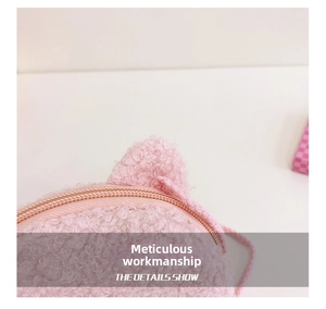 Close-up of pink sherpa fleece texture and zipper detail on cute animal crossbody bag
