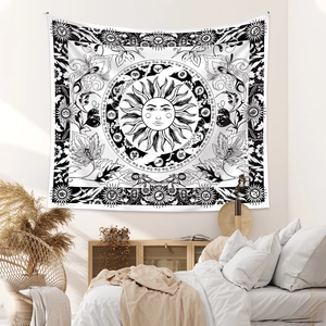 Detailed macro view of the black and white sun astrology tapestry in a bohemian bedroom setting